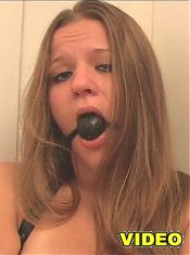 Gagged plumper with bound hands dildoes herself